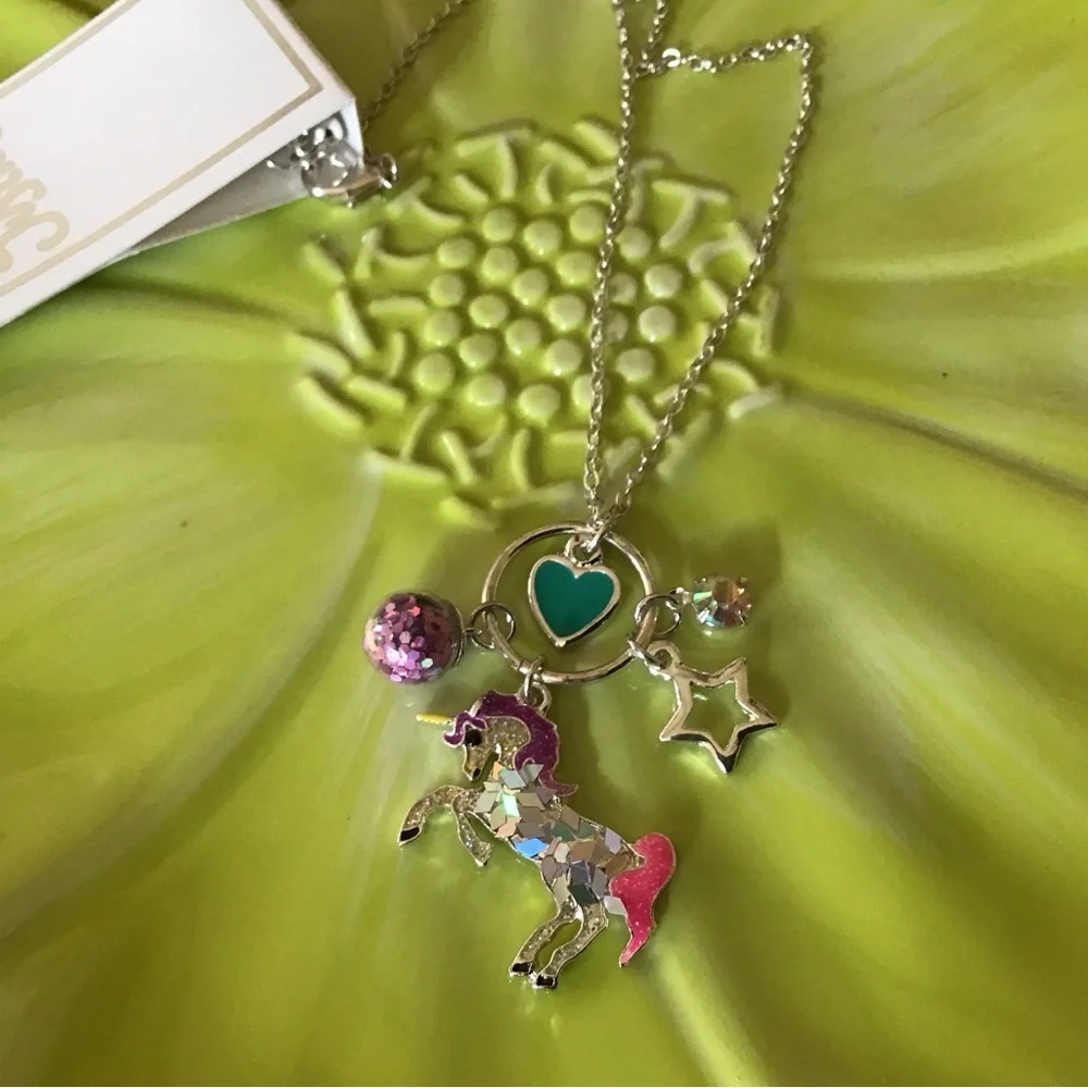 NWT Justice necklace. Unicorn, heart, glitter ball, star and rhinestone charms.
